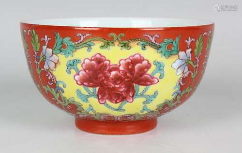 A Chinese coral ground famille rose porcelain bowl