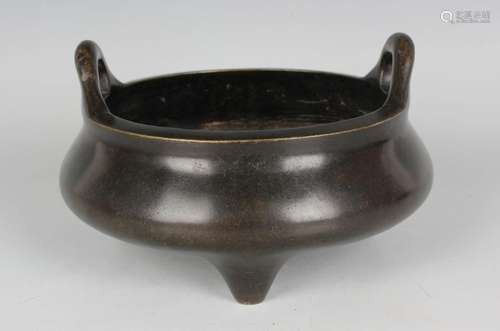 A Chinese brown patinated bronze bombé censer