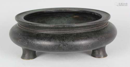 A Chinese dark brown patinated bronze censer of squat circul...