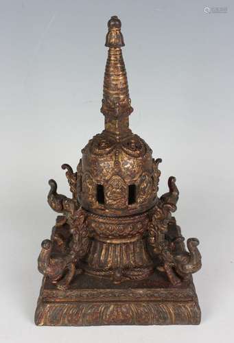 A Tibetan style gilt metal stupa