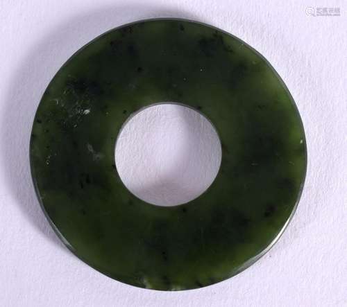 AN 18TH CENTURY CHINESE CARVED SPINACH JADE DISC Qing. 4.25 ...