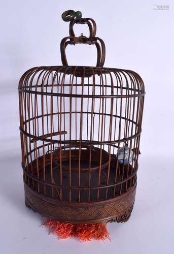 AN EARLY 20TH CENTURY CHINESE CARVED BAMBOO BIRD CAGE with j...