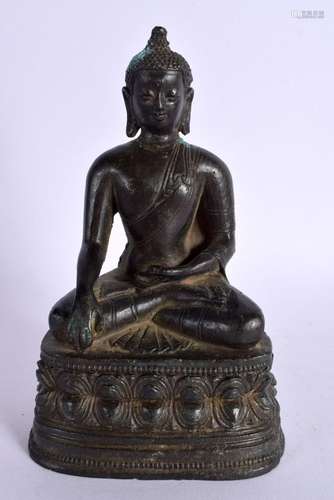 A 19TH CENTURY CHINESE TIBETAN BRONZE FIGURE OF A SEATED BUD...