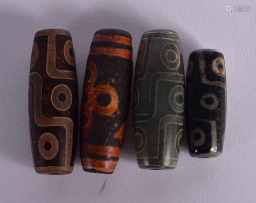 FOUR CHINESE TIBETAN CARVED STONE ZHU BEADS 20th Century. La...