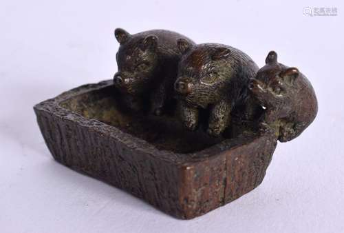 A JAPANESE BRONZE PIG TROUGH OKIMONO. 4.5 cm x 2 cm.