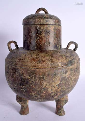 A CHINESE TWIN HANDLED BRONZE CENSER AND COVER 20th Century....