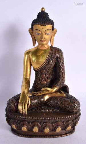 A CHINESE TIBETAN POLYCHROMED GILT BRONZE FIGURE OF A BUDDHA...