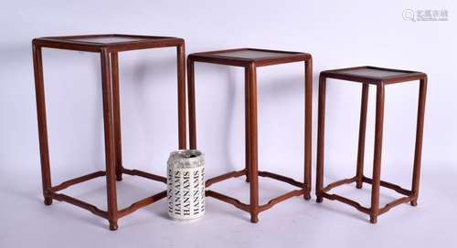 A NEST OF THREE EARLY 20TH CENTURY CHINESE HARDWOOD STANDS L...