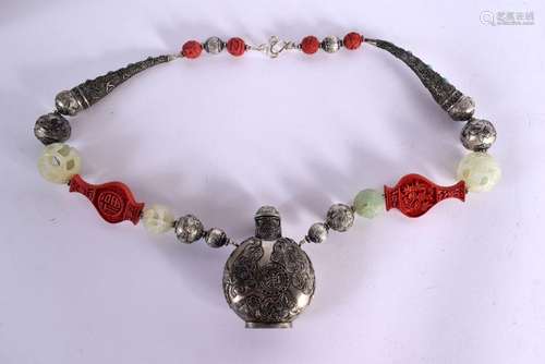 A CHINESE CINNABAR LACQUER WHITE METAL SCENT BOTTLE NECKLACE...