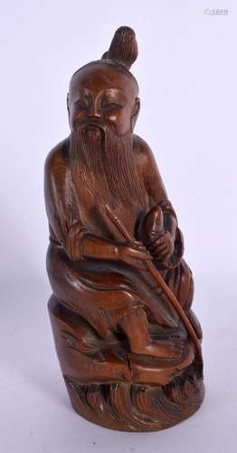 AN 18TH/19TH CENTURY CHINESE CARVED BAMBOO FIGURE OF A FISHE...