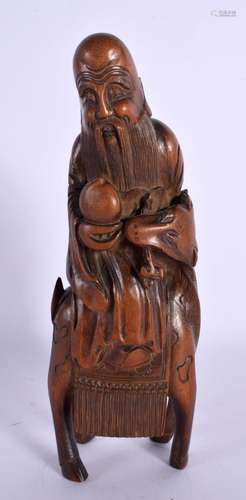 AN 18TH/19TH CENTURY CHINESE CARVED BAMBOO FIGURE OF SAGE La...