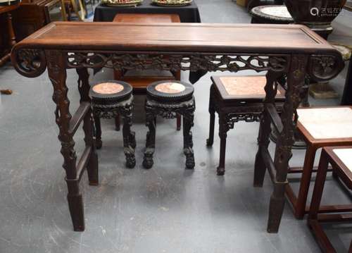 A LATE 19TH CENTURY CHINESE CARVED HARDWOOD SCROLLING TABLE ...