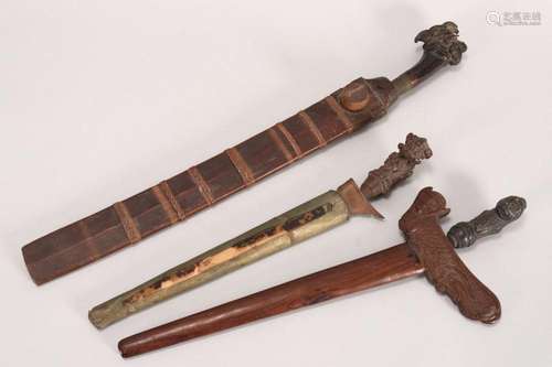 Three Javanese Kris and Sheaths,