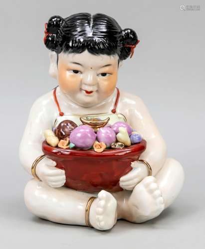 Porcelain figure of a girl with fru