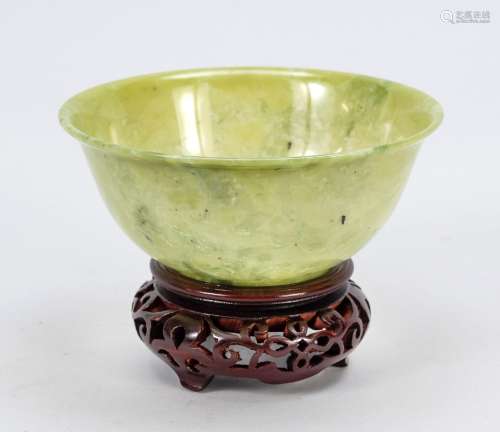 Jade bowl on base, China, thinly cu