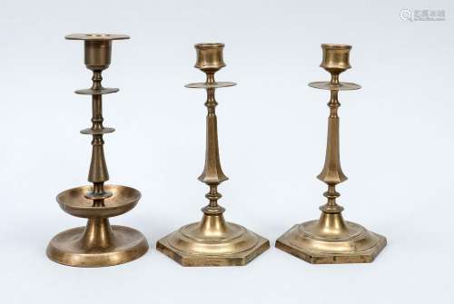 Group of brass candlesticks, a pai