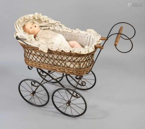 Porcelain head doll in a pram, 1st