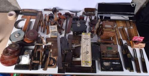A collection of Vintage tools, including wooden tape measure...