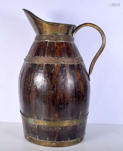 A large antique wooden brass bound pitcher. 43 x 66cm.