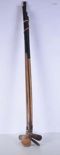 An antique Willie Dunn hickory shafted golf wood together wi...