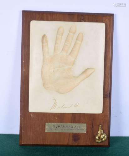 A mounted plaque of Mohamed Ali`s hand 38 x 26 cm.