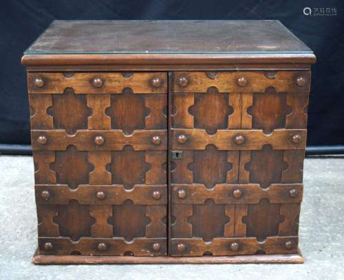 A walnut Arts and Crafts 12 glass topped drawer collectors c...