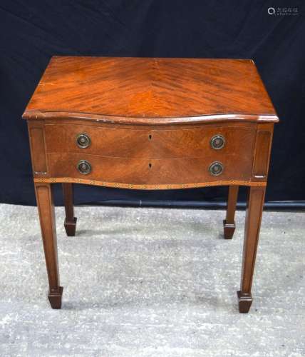A mahogany 2 drawer cutlery table containing a Thomas Ward &...