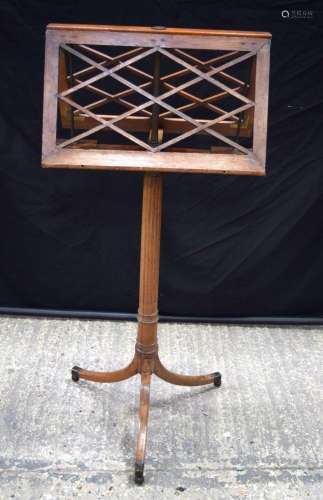 An antique duet music stand on castors by Erards of London. ...