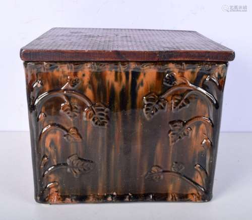 An antique treacle glazed bread bin with wooden lid decorate...