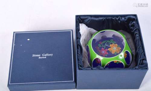 A boxed Peter McDougall paperweight with a bouquet set on a ...