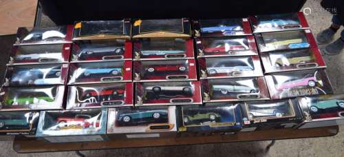 A collection of Road Signature boxed model cars 36 x 15 x 15...