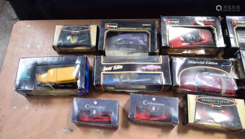 A collection of boxed Burago model cars together with other ...