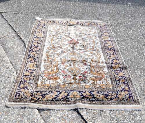 A Persian rug depicting birds in foliage 188 x 132 cm.