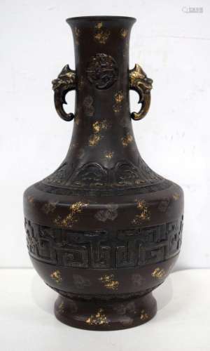 A large Chinese Porcelain vase decorated with symbols and be...