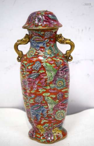 A small Chinese porcelain twin handed lidded vase decorated ...