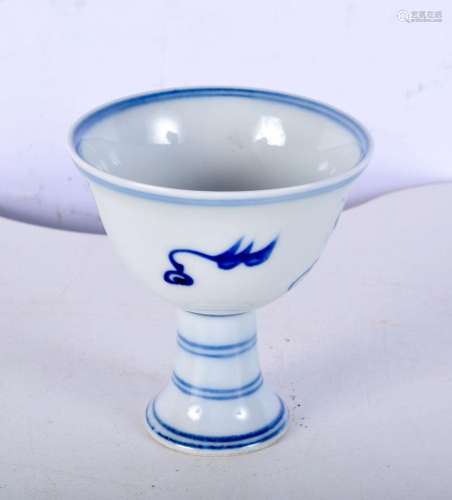 A small Chinese porcelain blue and white stem cup decorated ...