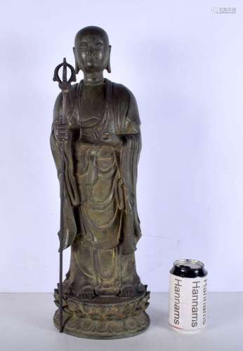 A large Chinese Tibetan bronze figure on a stand. 33cm.