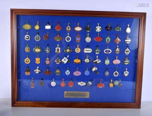 A framed collection of enamelled badges of the racecourses o...