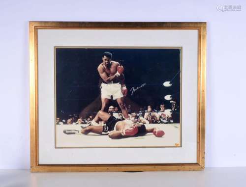 A framed and autographed Muhammad Ali picture. 40 x 50cm.