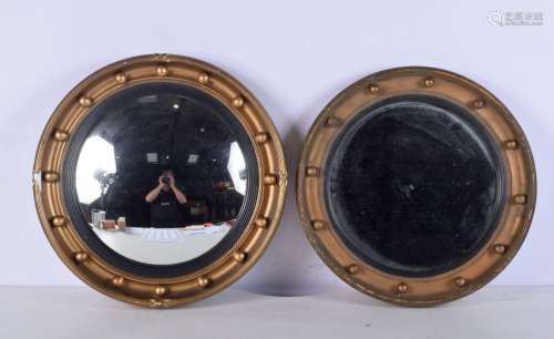A framed convex mirror together with a similar mirror. 42cm.