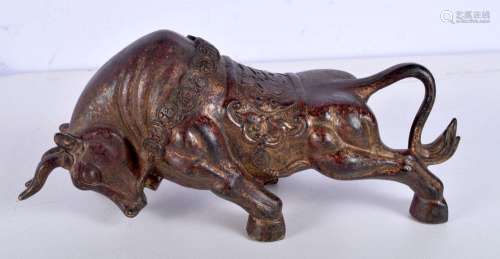 A large gilded bronze figure of a bull. 12 x 25cm.