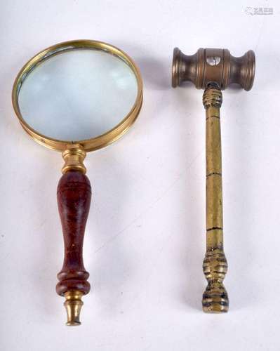 A wooden handled and brass magnifying glass together with a ...