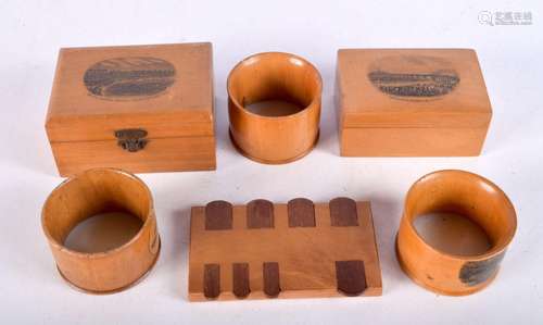 A collection of Treen boxes along with napkin rings and a Pa...