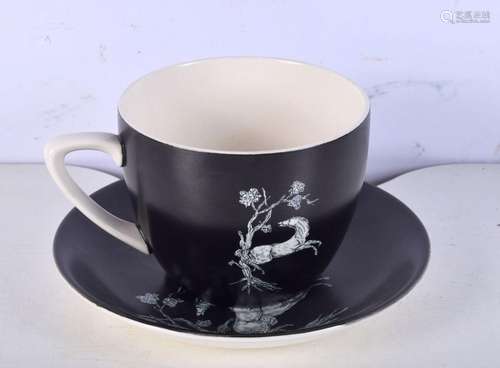 A large Crown Devon cup and saucer decorated with horses. 10...