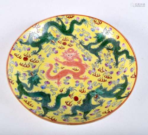 A Chinese porcelain Famille Jaune dish decorated with dragon...