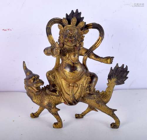 A Chinese bronze of a figure riding a beast. 20 x 16cm.