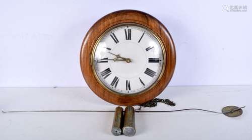 A wooden surround wall clock. Diameter 38cm.