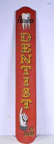 A wooden painted dentist`s advertising sign. 87 x 13.5cm.