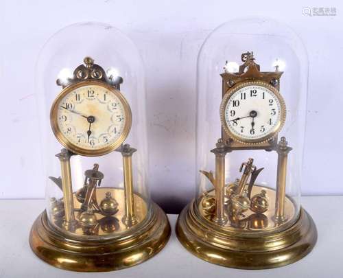 A pair of brass, enamel faced, domed mantel clocks. 30cm.