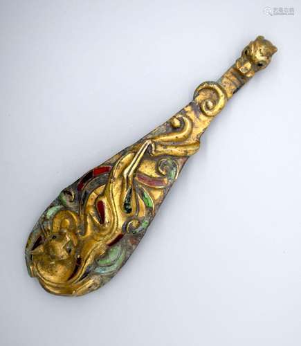 A large Chinese bronze belt buckle with enamelled scrolls 20...